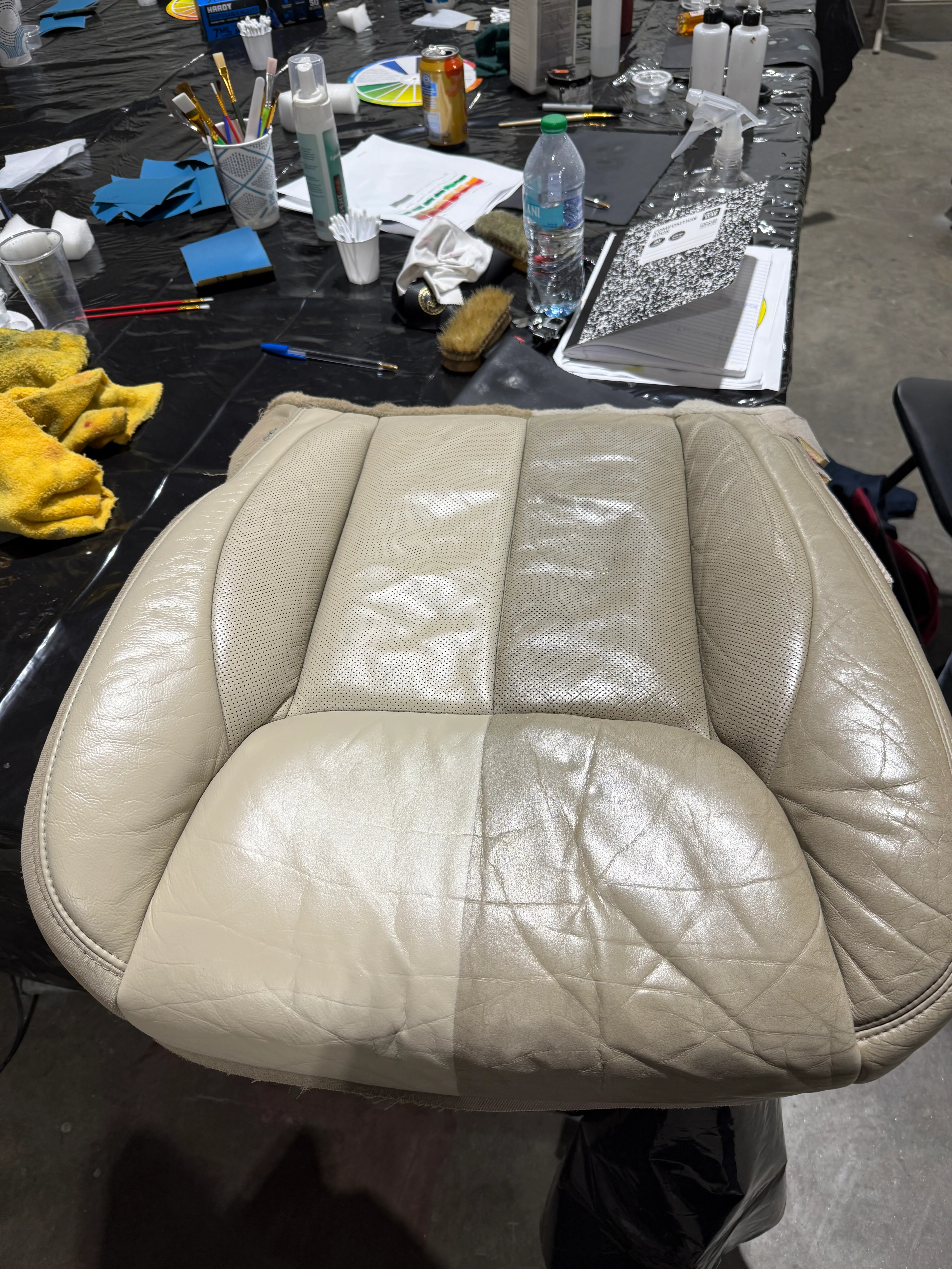 Worn leather car seat before and after restoration